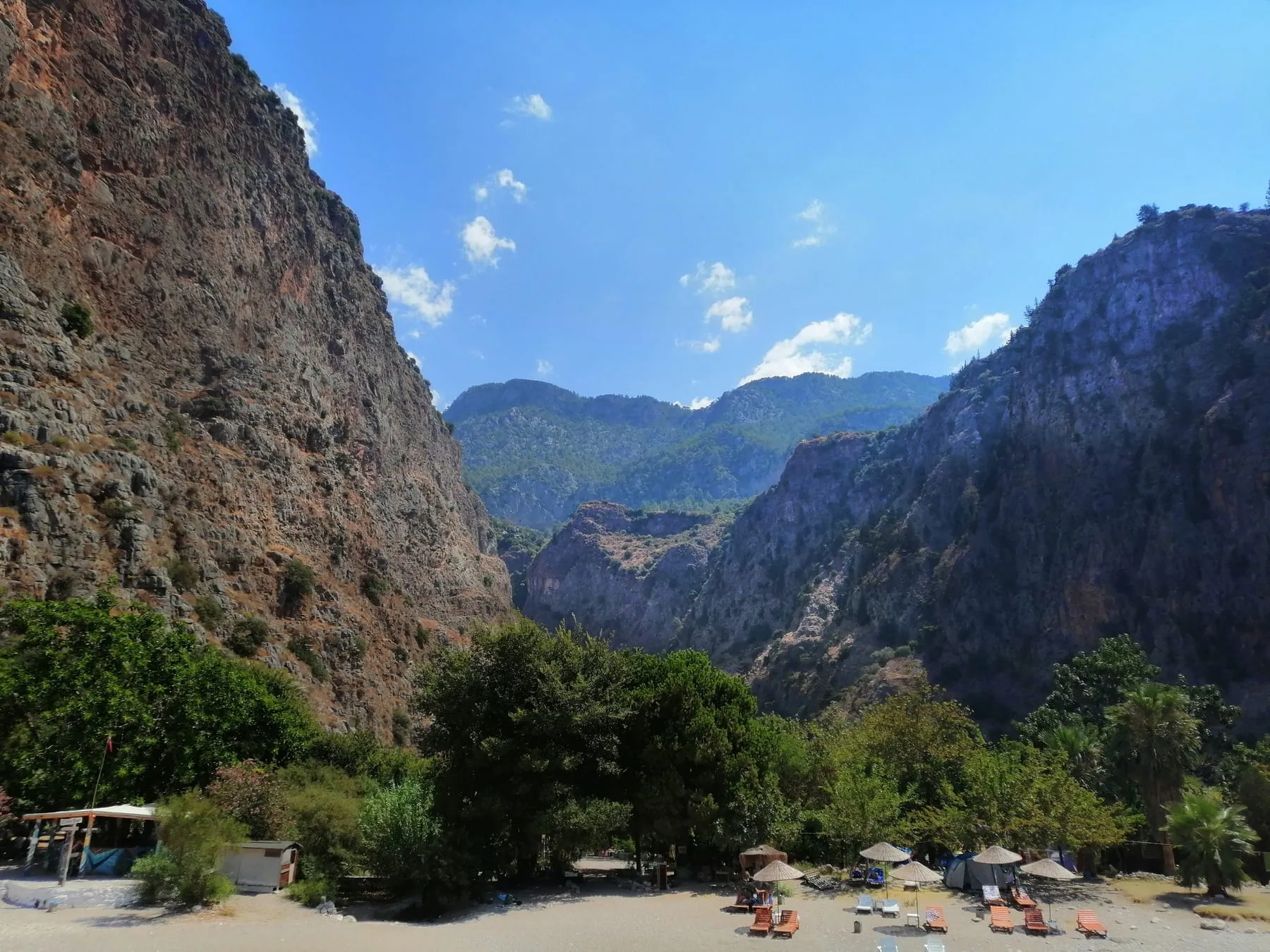The steep green walls and beach of Butterfly Valley on Turkey's Turquoise Coast
