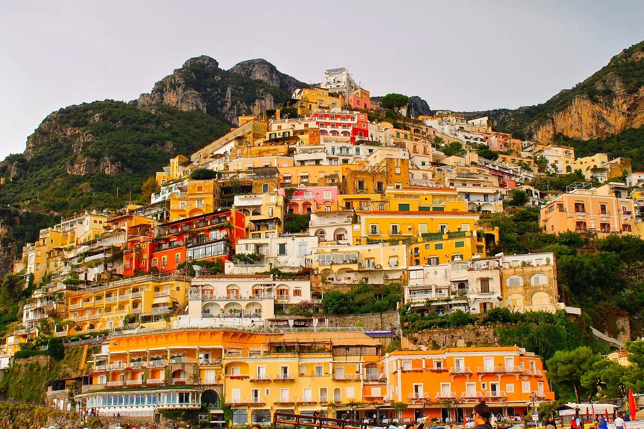The pastel houses of Positano climbing the Amalfi Coast above the sea, Italy