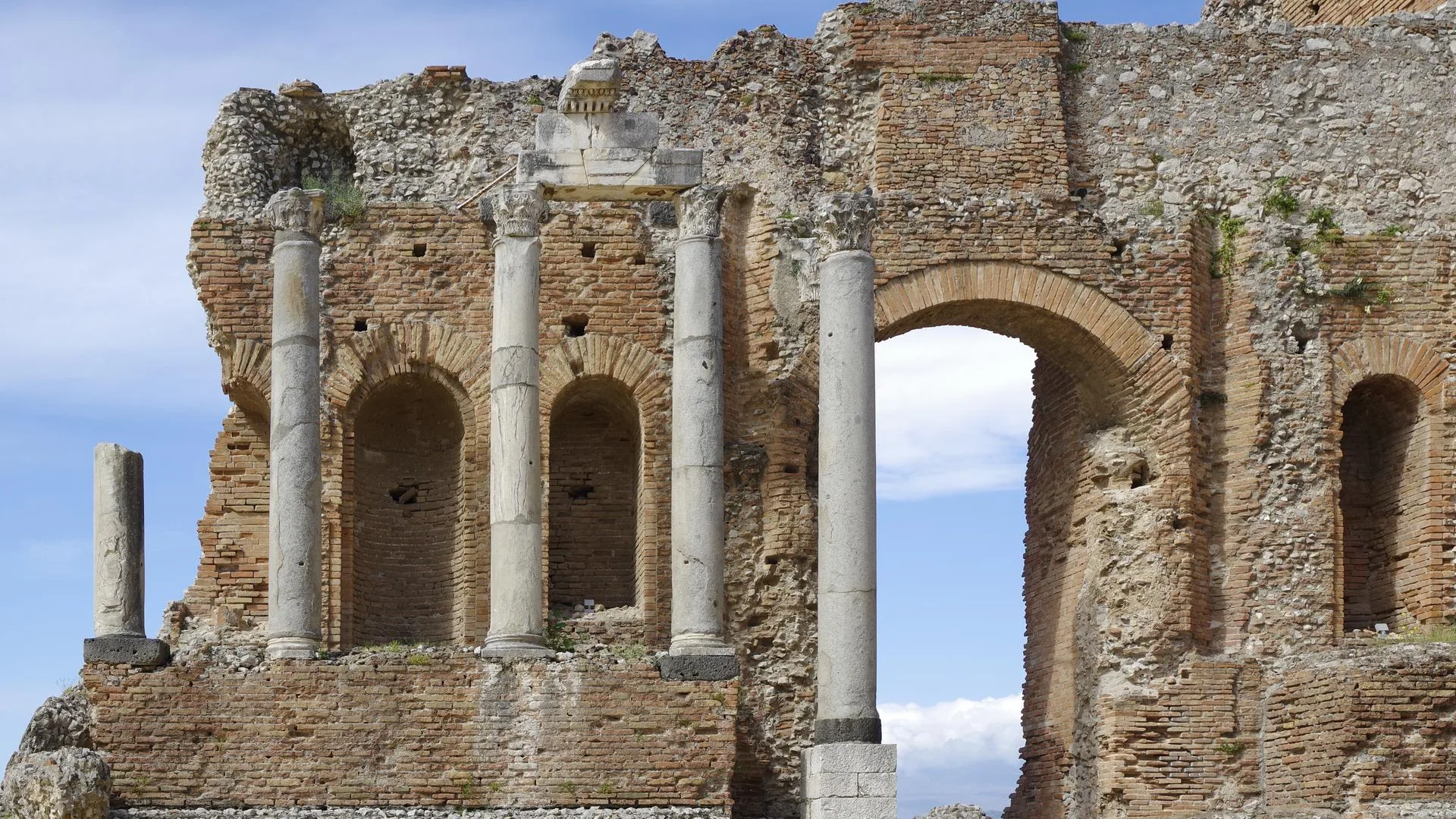 The Greek theatre of Taormina with Mount Etna rising behind it, Sicily, Italy