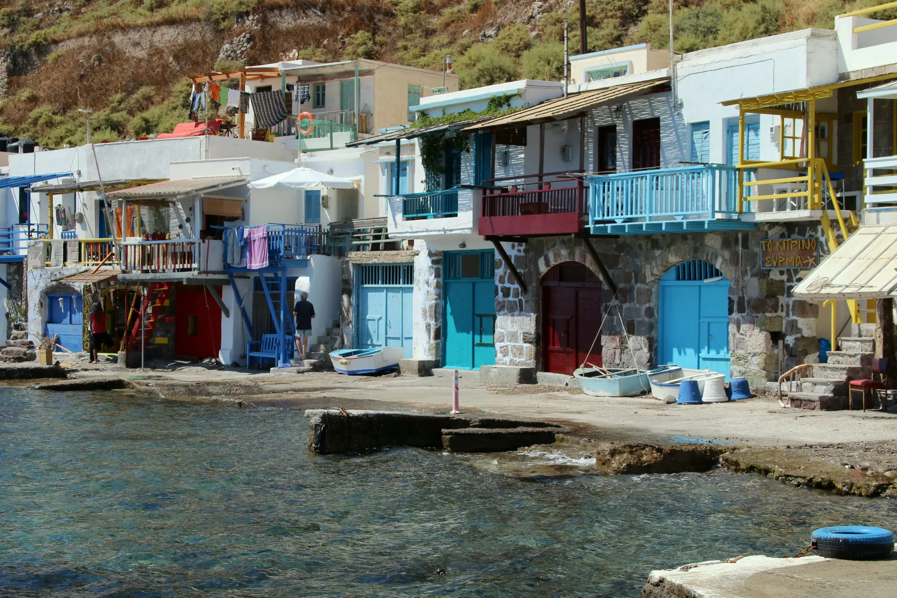 The painted syrmata boathouses of Klima on the coast of Milos, right above the water