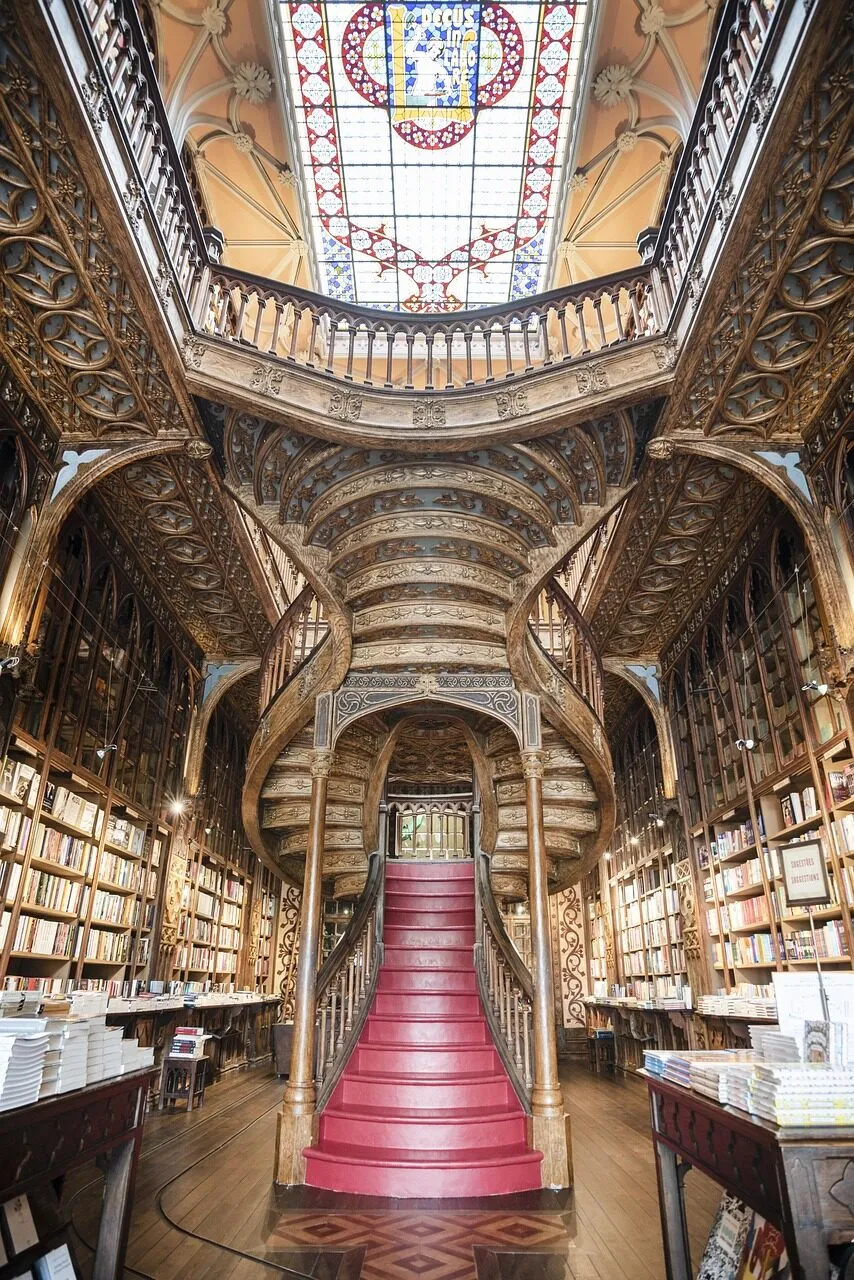 The ornate forked staircase inside Livraria Lello in Porto